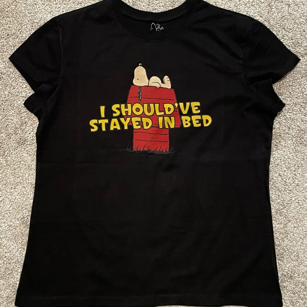 Peanuts Black Tee with Red Doghouse and Yellow Text